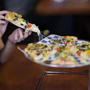 a woman eating a slice of pizza