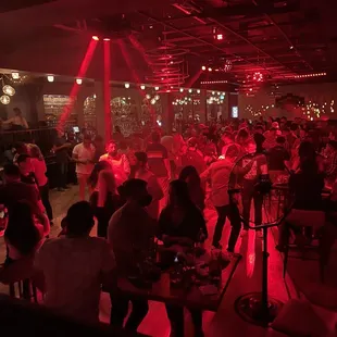 a large group of people sitting at tables