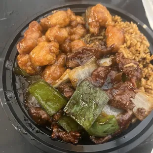 Medium size beef and peppers and orange chicken on fried rice