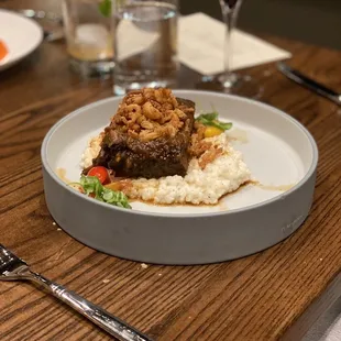 a plate of food on a wooden table