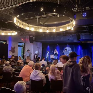 a group of people sitting at tables