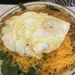 Jacobs special: hash browns covered with beans, spinach, cheese, and two eggs.