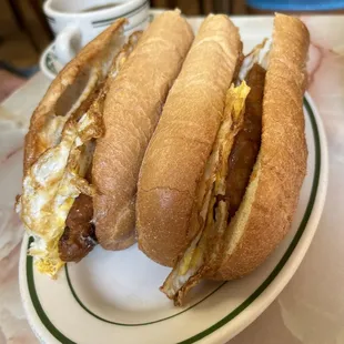 a plate with three sandwiches on it