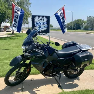 a motorcycle parked on a sidewalk