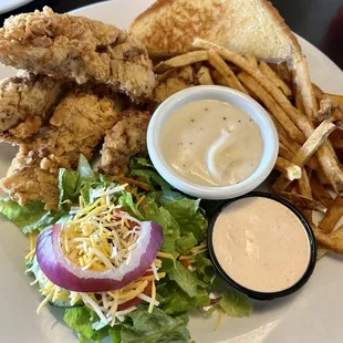 Steak fingers with fries, ranch for the salad.