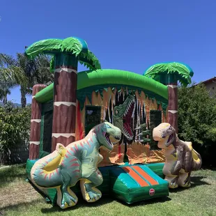 Dinosaur Jumper with two t-rex on side. 15 ft by 15 ft