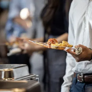 a man holding a plate of food