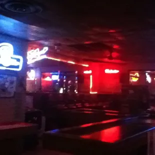 a bar with neon signs