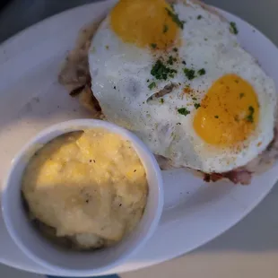 Cochon de lait biscuit with a side of grits