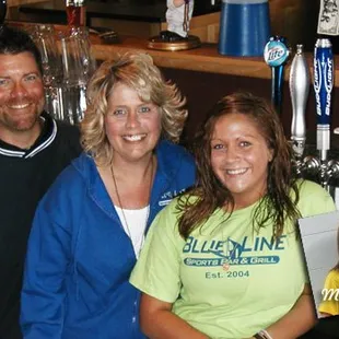 three people posing for a picture
