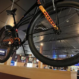 a bicycle hanging from the ceiling