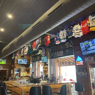 sports jerseys hanging from the ceiling