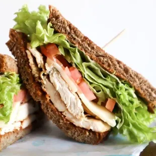 Whole wheat bread, chipotle dressing, chicken breast, lettuce, tomato and muenster cheese.