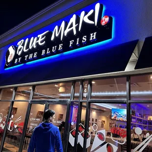 people walking in front of the store