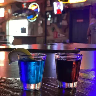 two shot glasses of alcohol
