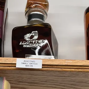 a bottle of blue max on a shelf