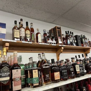 a shelf of liquor bottles