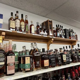 a shelf of liquor bottles