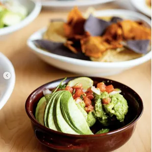 Guacamole with Rainbow Chips (blue corn, yellow tortilla, and sweet potato chips). Like everything we serve, our chips are homemade!