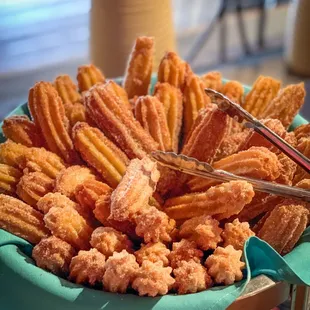 Warm Churros served with chocolate and cajeta sauces - a brunch favorite!