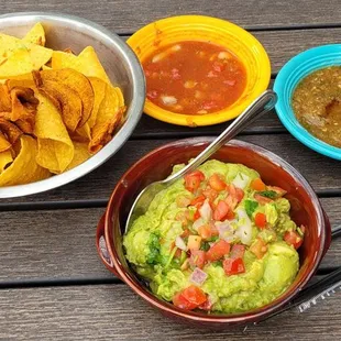 Tortilla and sweet potato chips, 2 salsas to enjoy and our guacamole.