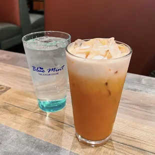a cold beverage and a glass of water