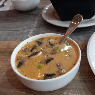 Tom Kha - Coconut lemongrass soup, spicy chili, galangal, coconut milk, cilantro, mushrooms | Add shrimp $2, a bowl for $10.00