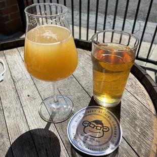 a glass of beer and a coaster