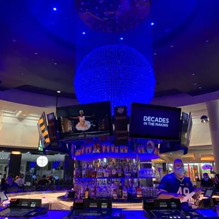 a bar with a large chandelier