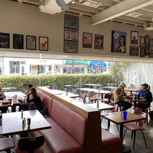 people sitting at tables in a restaurant