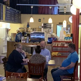 a group of people sitting around a table