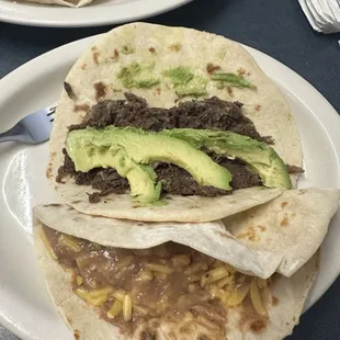 Barbacoa taco  Bean and cheese taco
