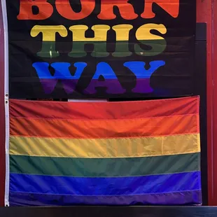 a rainbow banner that reads born this way