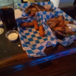 Reuben Sandwich (Back), Mozzerela Sticks 6 piece (Left), Chicken Wings 6-Piece.(Right)