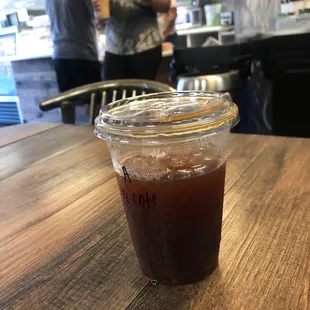 Half caff americano with counter in background