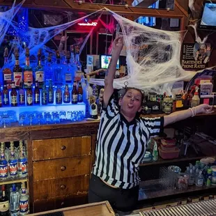 Halloween decorations and funny bartender