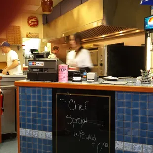 two chefs working in a restaurant kitchen
