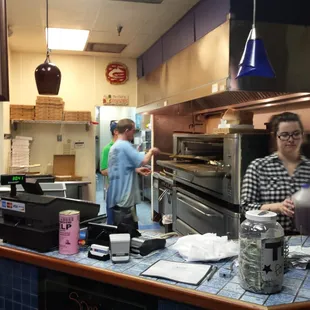 a man and a woman in a kitchen