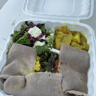 a meal in a styrofoam container