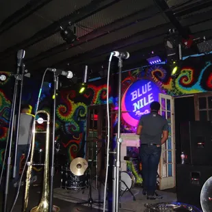 a man standing in front of a stage