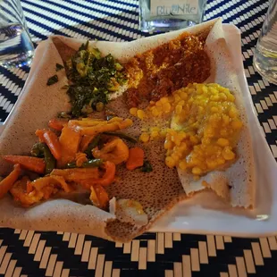 Veggie combo, left to right:  Gomen (collard greens), misir (Split red lentils), Yatakilt (Carrots, string beans), and Ye&apos;kik Alicha