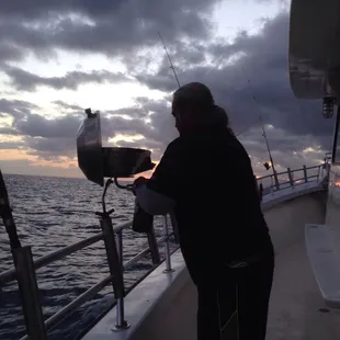 Warren grilling our catch!! Mmmm!