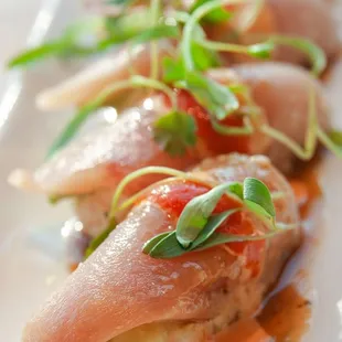 French Kiss: krab and avocado base topped with albacore, garlic mustard, spicy mayo, and
chili drop