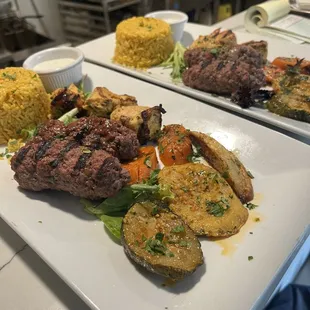 Beef kofta and chicken kebab mix platter, served with Mediterranean pilaf rice and grilled medley of vegetables