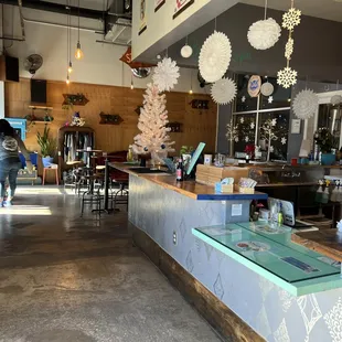 a bar with a christmas tree in the background