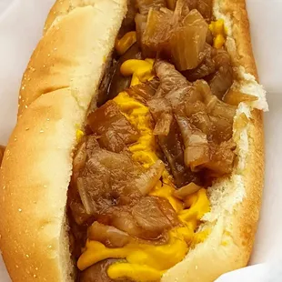Locally made bratwurst with grilled onions and mustard