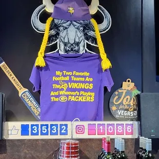 a purple t - shirt with a bull on it