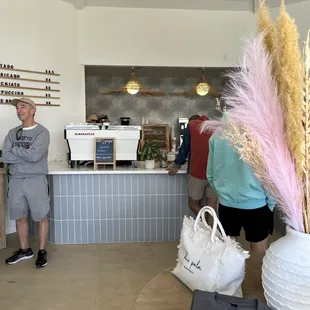 a man standing in front of a counter