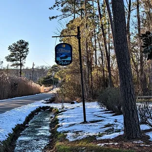 This is the street sign for the restaurant.  Photo taken January 26, 2022.