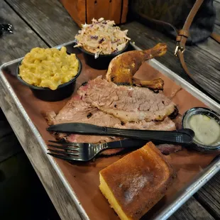 Two Meats platter with chicken, brisket, Mac and cheese and coleslaw